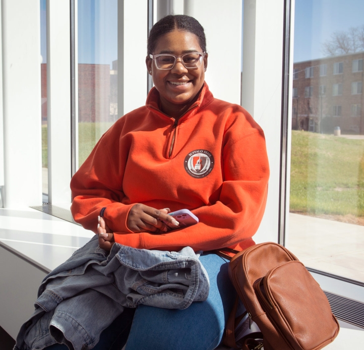 Student sitting in a hallway