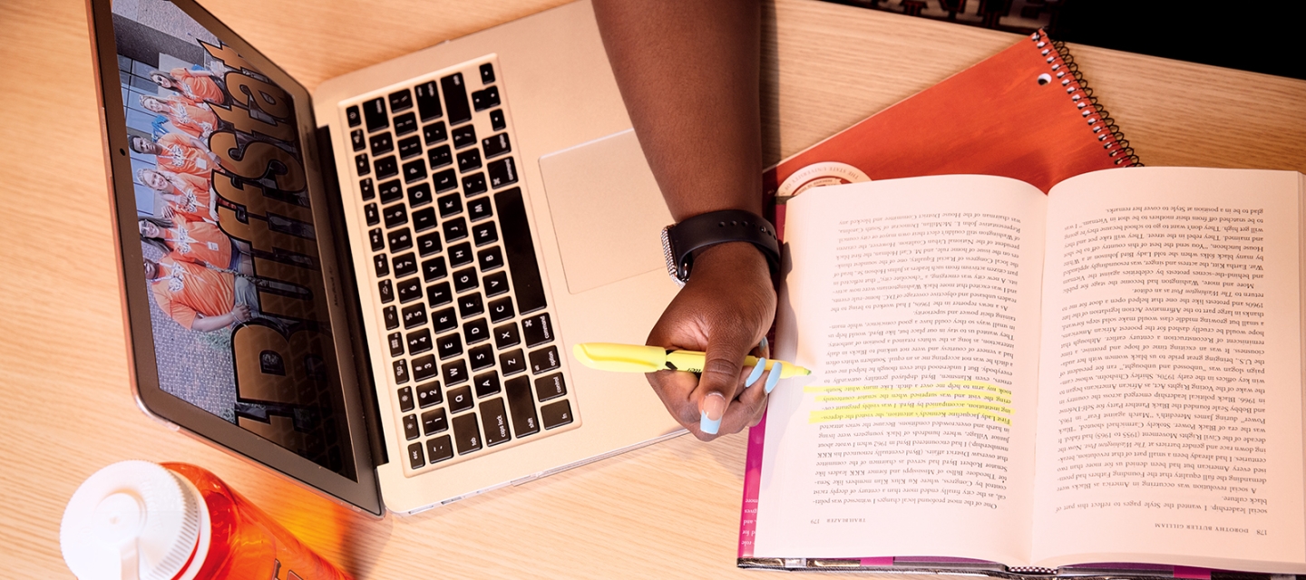 An open laptop and book